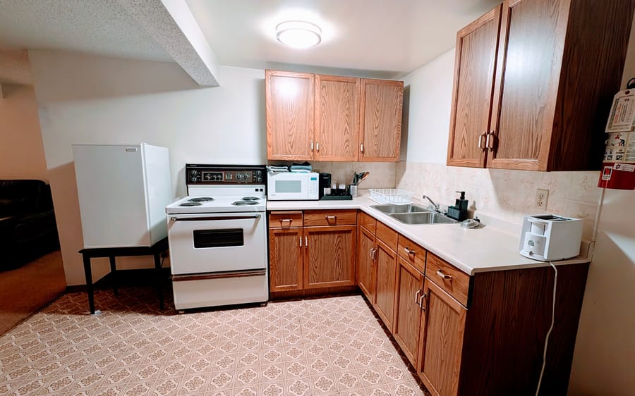 Full kitchen in a Birch Grove apartment-style suite