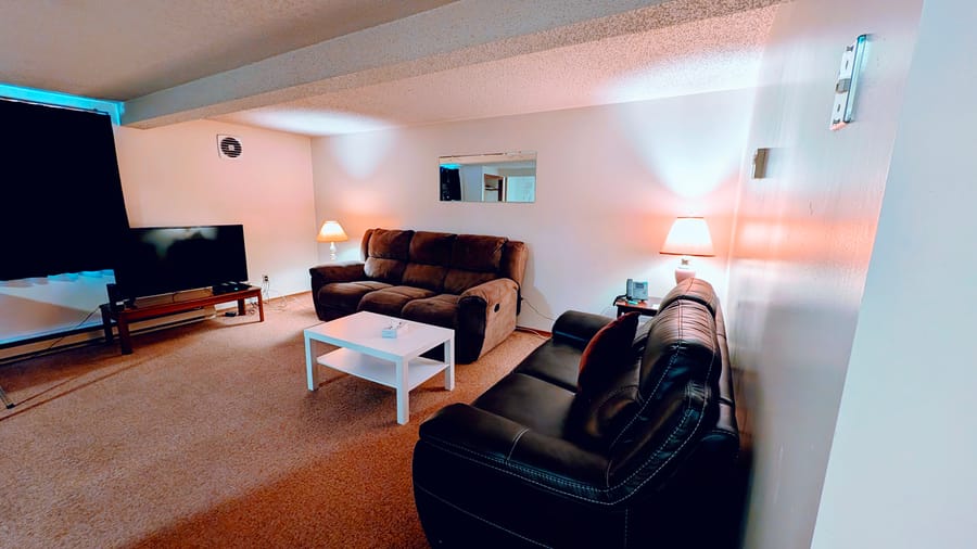 Lounge area with seating in a Birch Grove suite